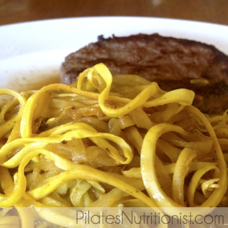 yellow zucchini noodles with a grassfed beef patty