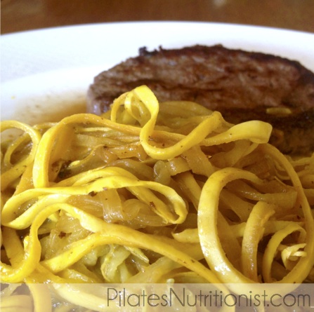 Zucchini noodles sauteed in ghee with grassfed beef burger